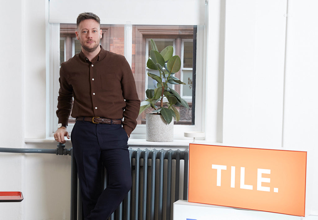 Lee standing his office wearing his Awling Braided belt.