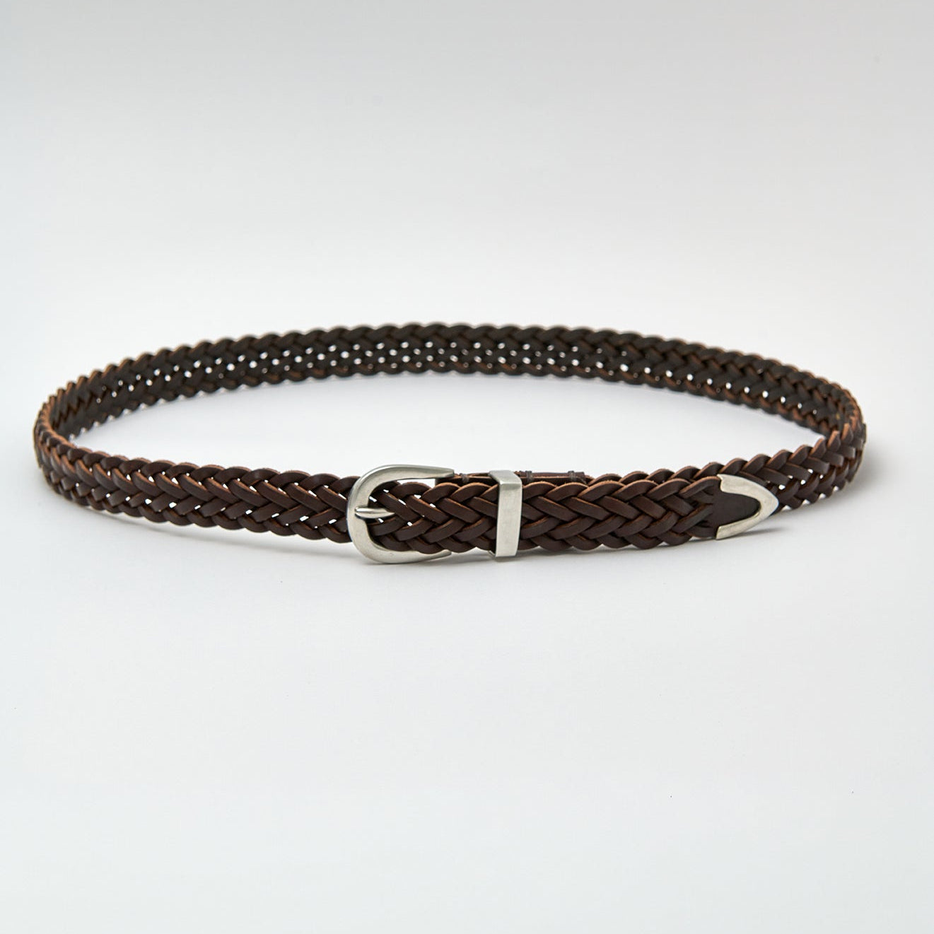 Brown braided belt with a silver buckle on a light gray background