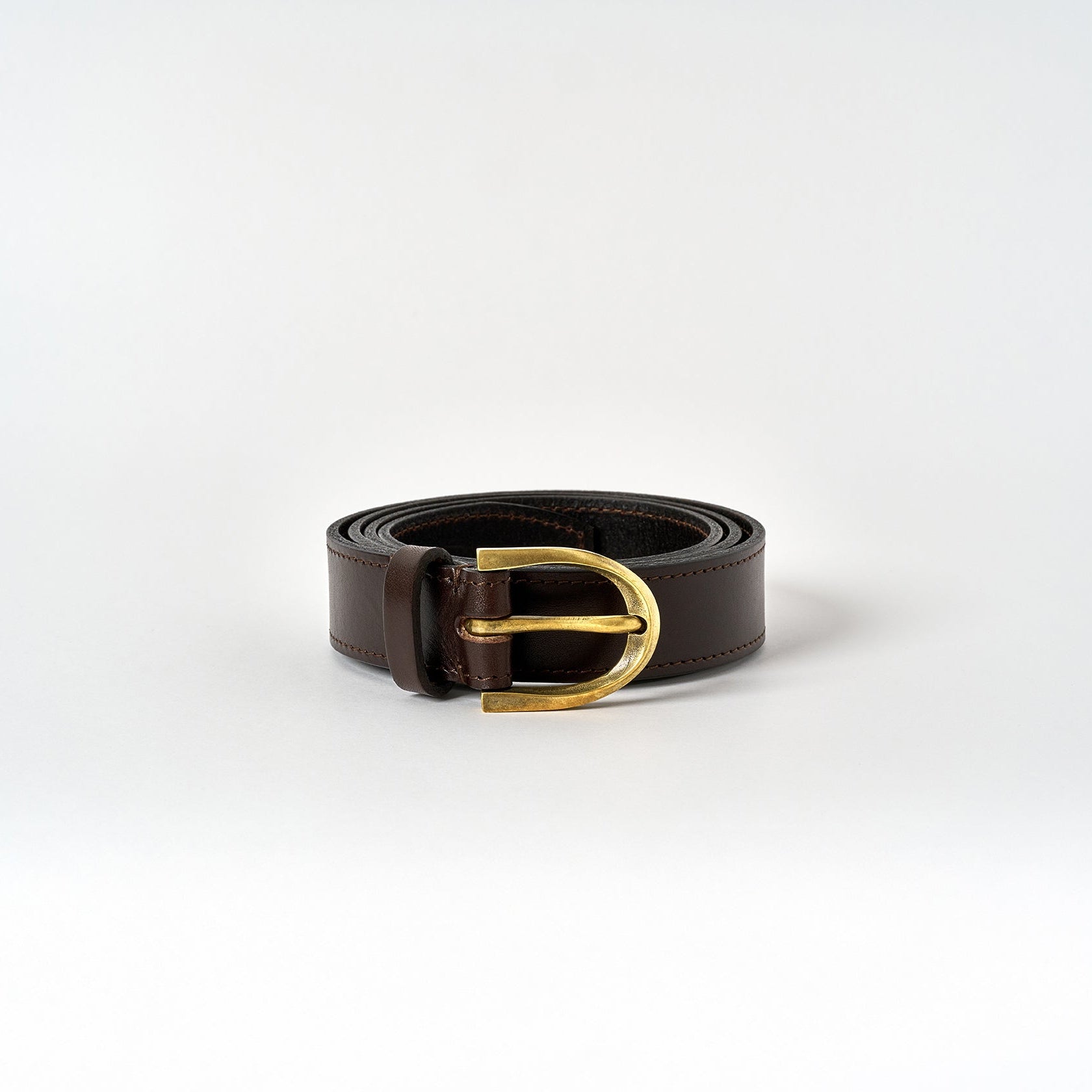 Brown leather belt with a gold buckle on a white background