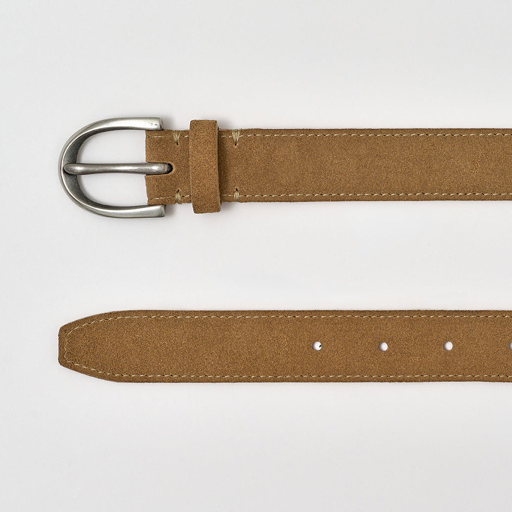 Brown belt with silver buckle on a white background