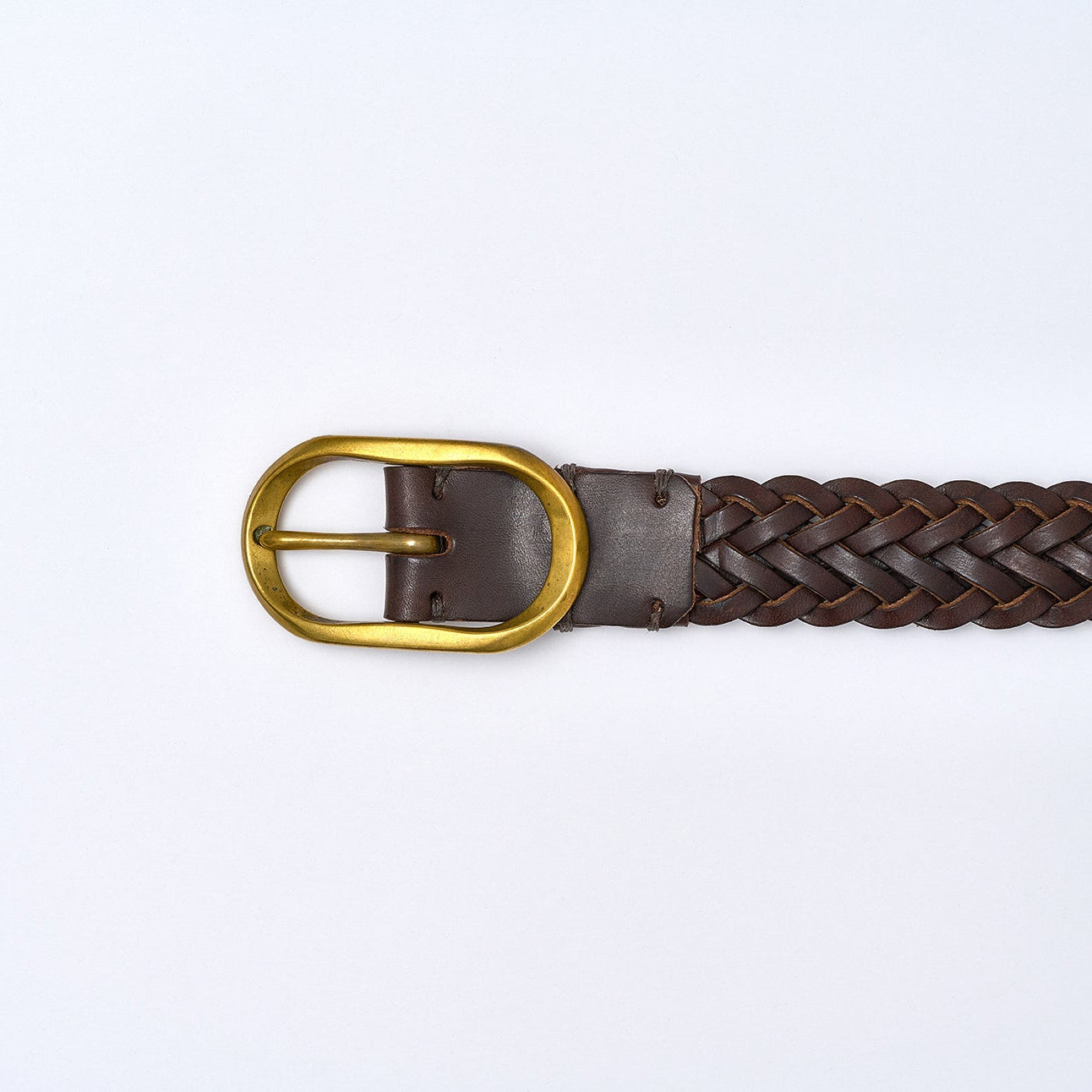 Brown braided belt with a gold buckle on a white background