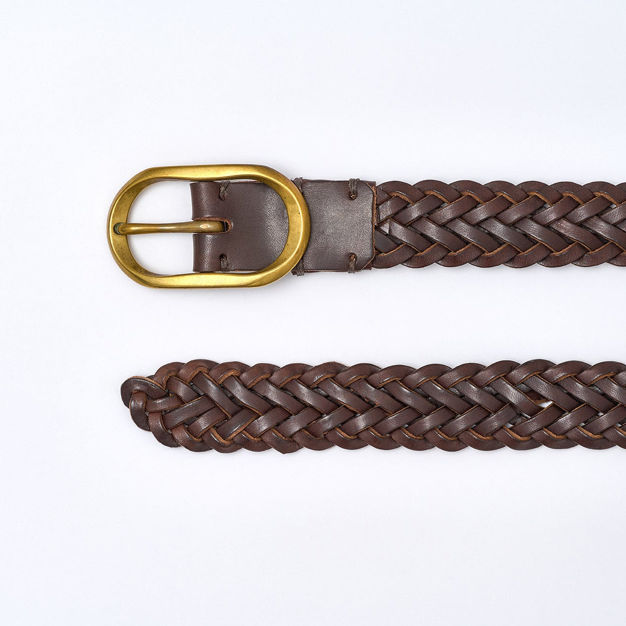 Brown braided belt with a gold buckle on a white background