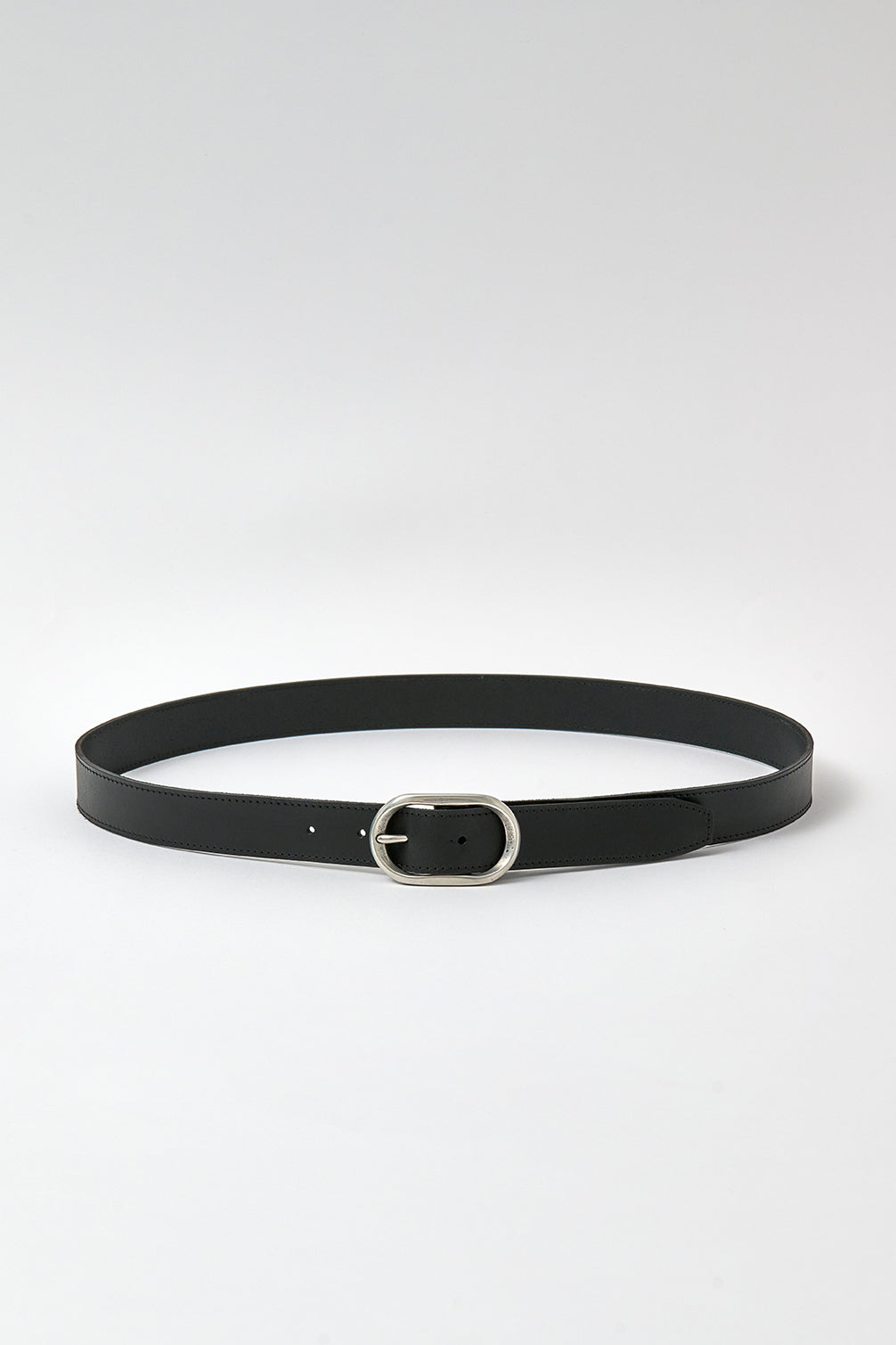 Black belt with silver buckle on a white background