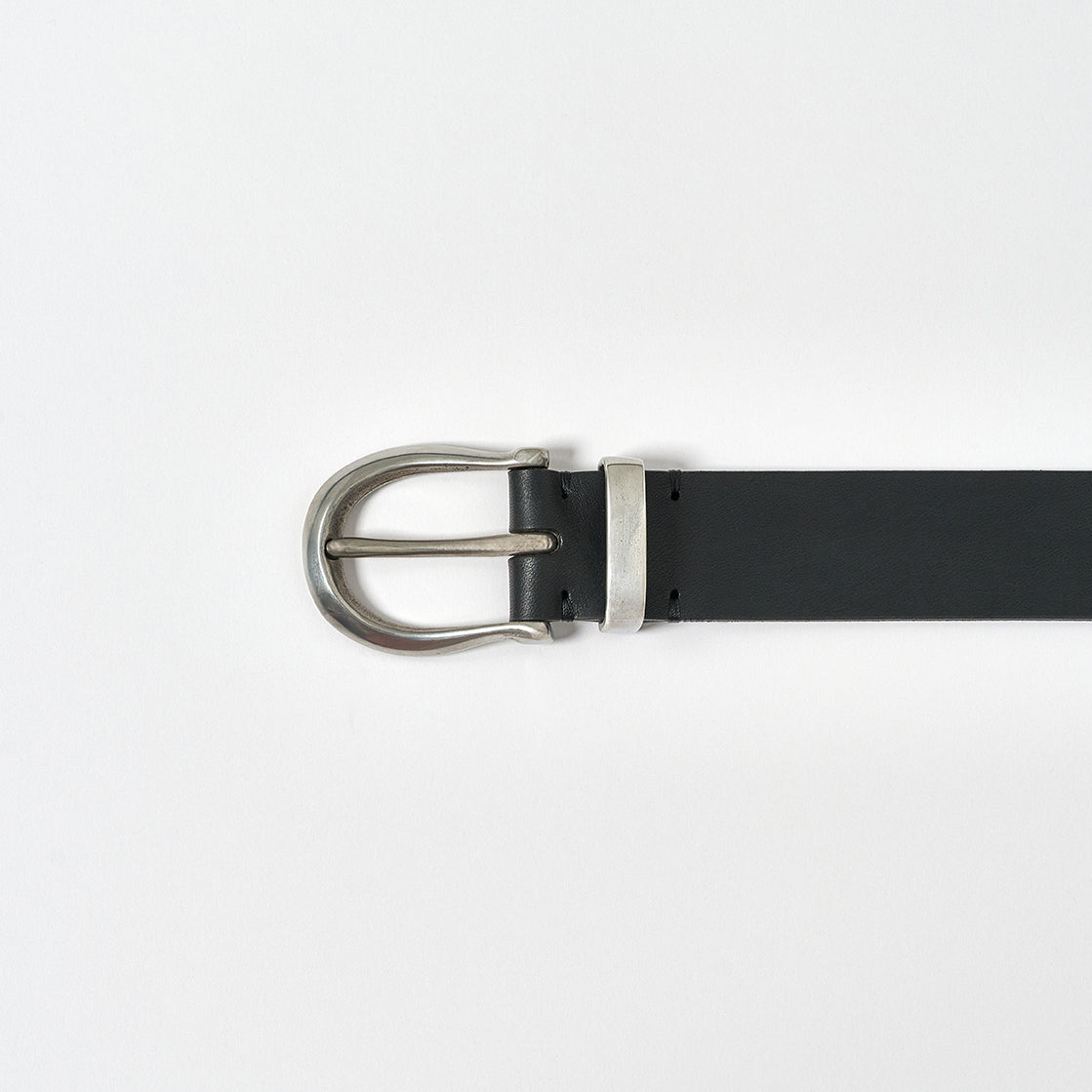 Black belt with silver buckle on a white background