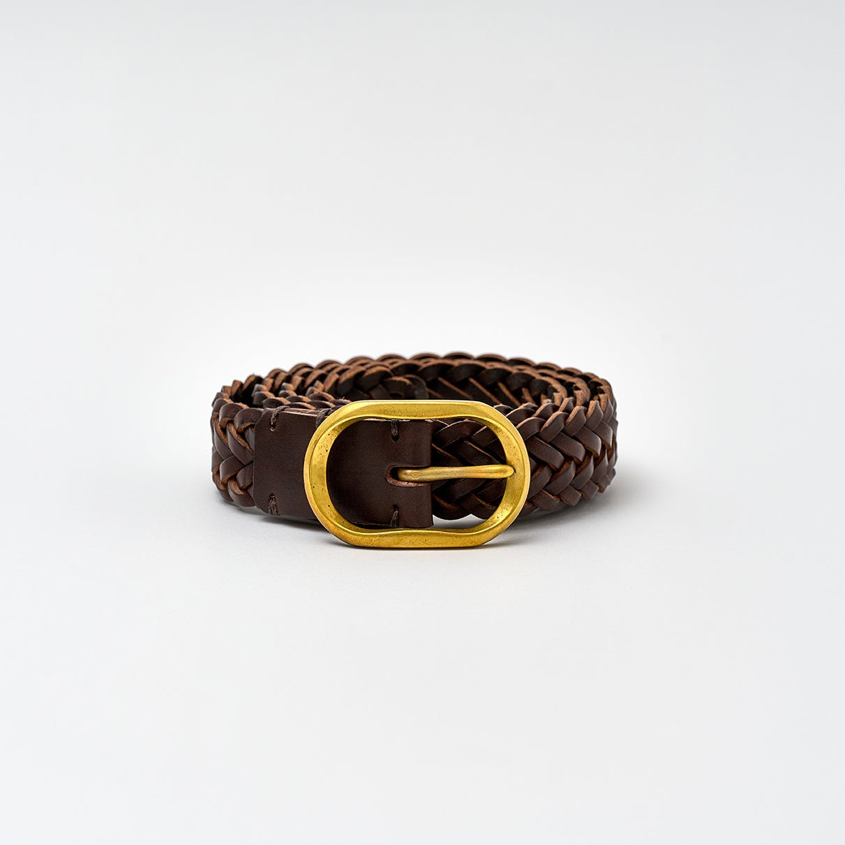 Brown braided belt with a gold buckle on a white background