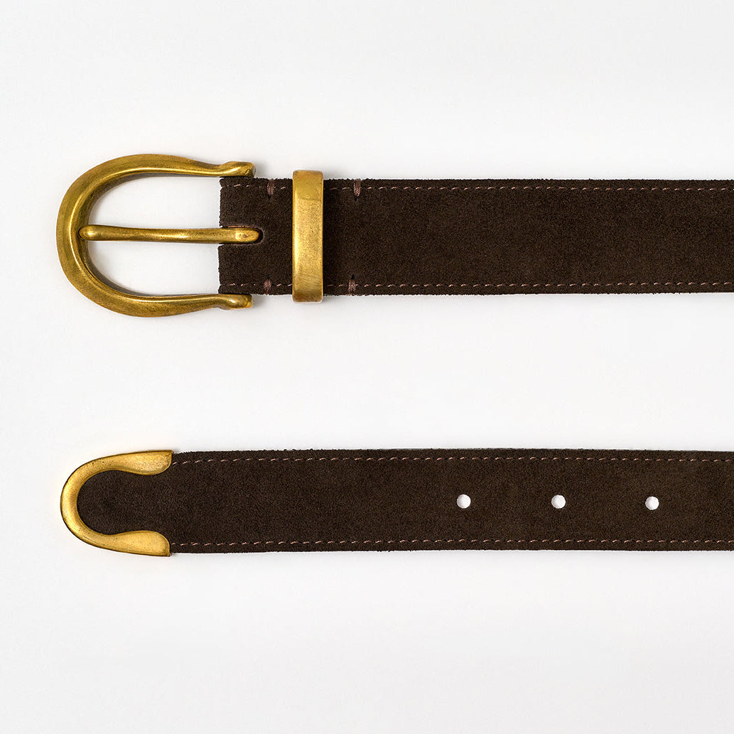 Brown belt with brass buckle on a white background