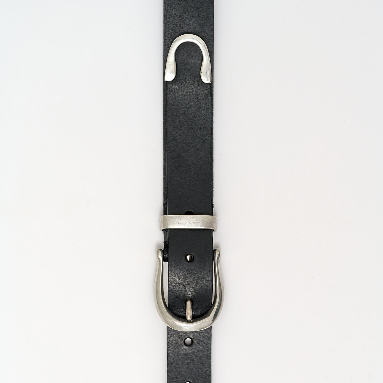 Black leather belt with silver buckle on a white background