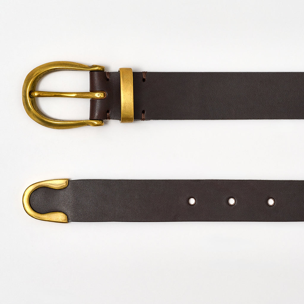 Brown leather belt with gold buckle on a white background